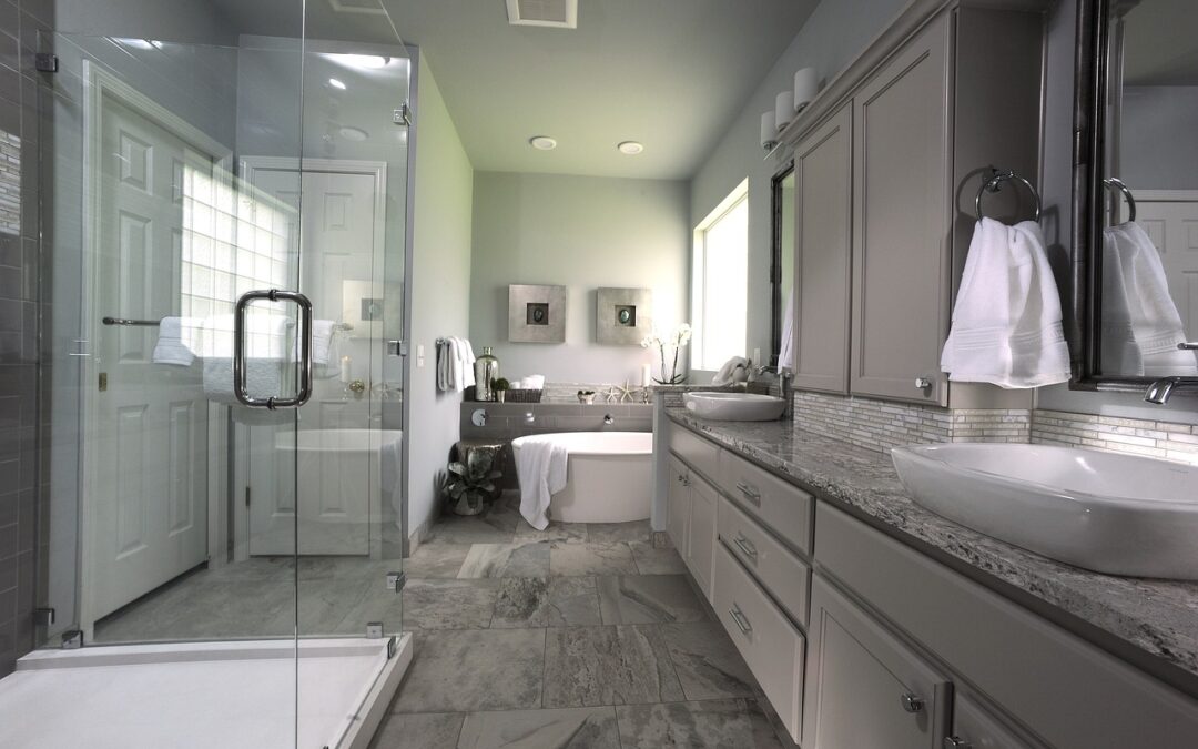 Photo of master bath with glass walkin shower, soaker tub and double raised porcelain sinks on granite countertops